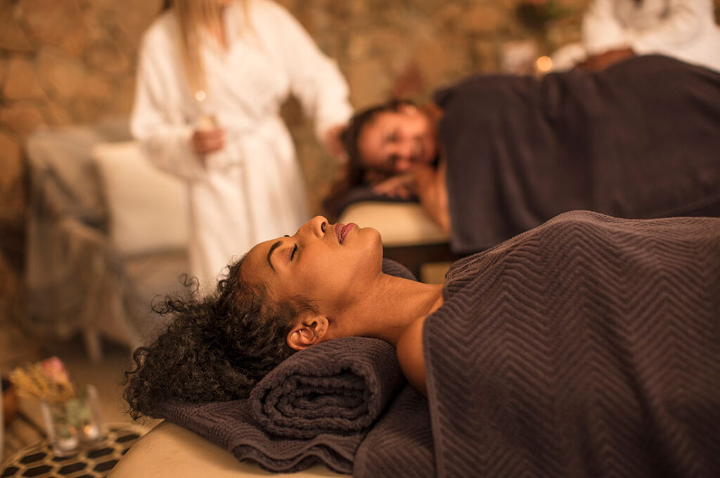 Two people receiving relaxing spa treatment